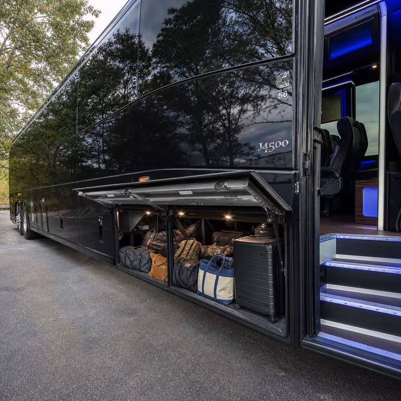 Party bus interior with wraparound leather seating and LED lighting in Greensboro