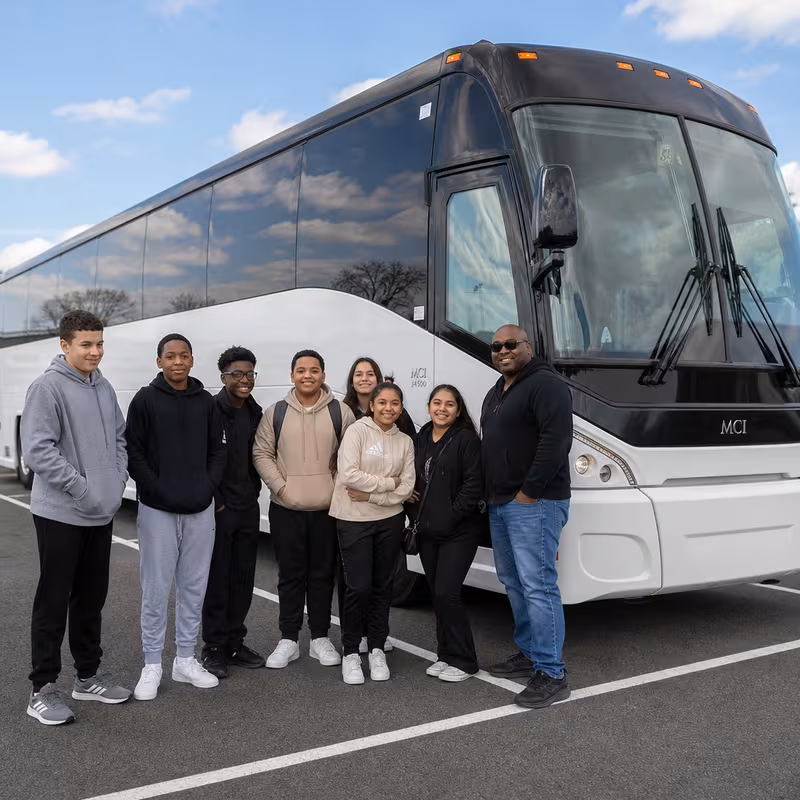 Passengers loading luggage while boarding an Greensboro group shuttle
