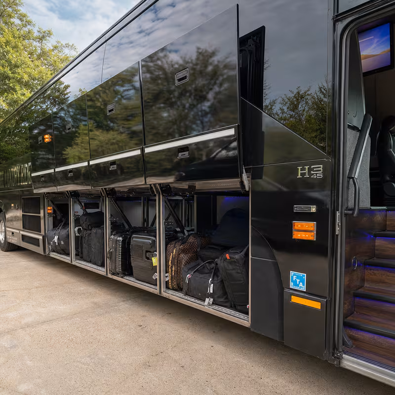Party bus interior with wraparound leather seating and LED lighting in Greensboro