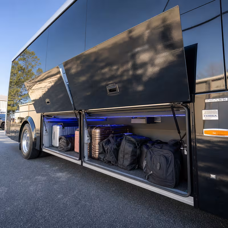 Party bus interior with wraparound leather seating and LED lighting in Greensboro