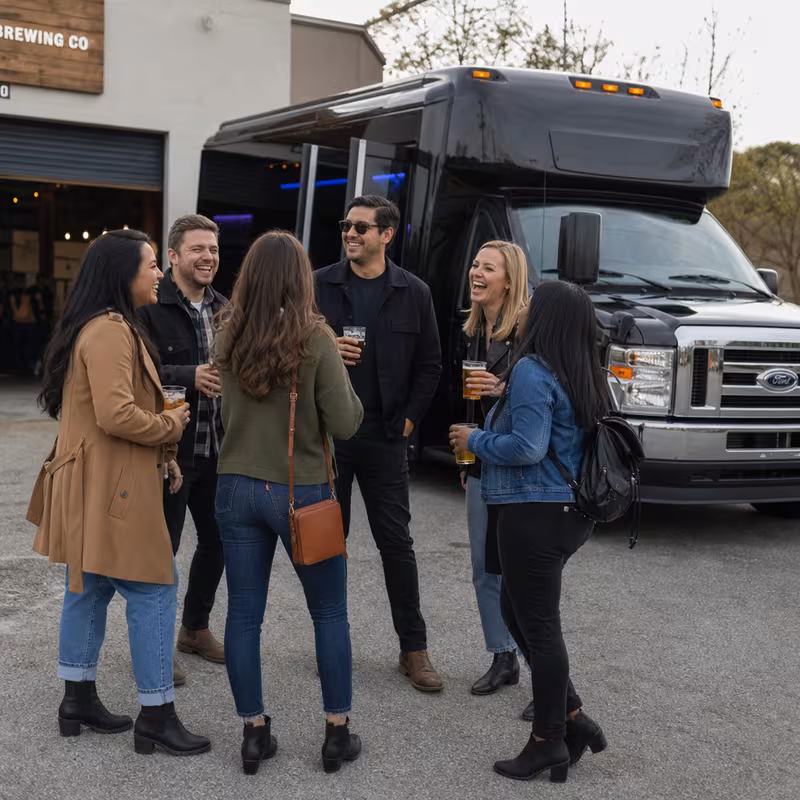 Passengers loading luggage while boarding an Greensboro group shuttle